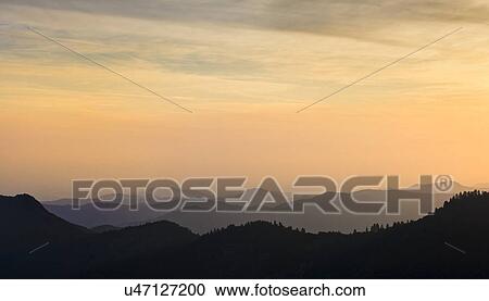 View of mountains at sunset View Large Photo Image Stock Image - View of mountains at sunset. Fotosearch