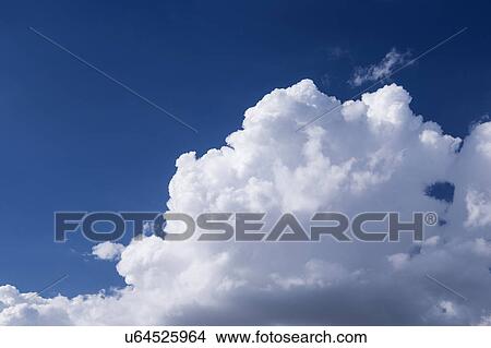 Picture - View of puffy cloud formations. Fotosearch