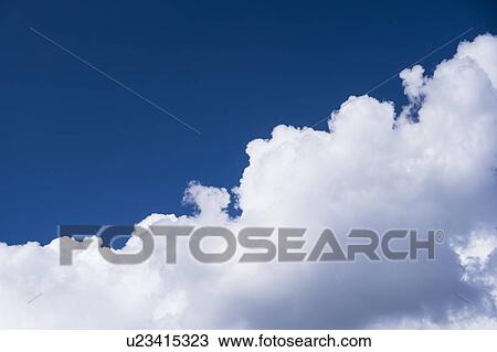 Stock Image - View of puffy cloud formations. Fotosearch