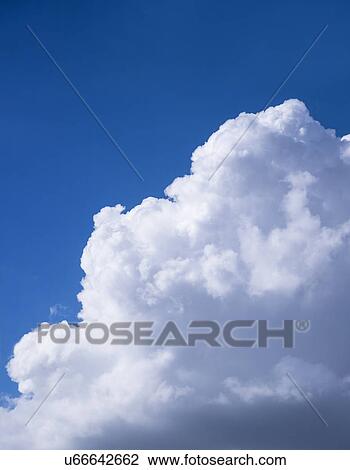 Stock Image - View of puffy cloud formations. Fotosearch