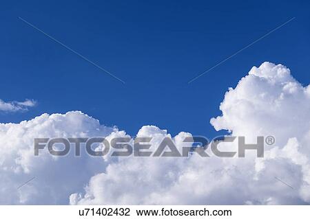 View of puffy cloud formations View Large Photo Image Stock Image - View of puffy cloud formations. Fotosearch