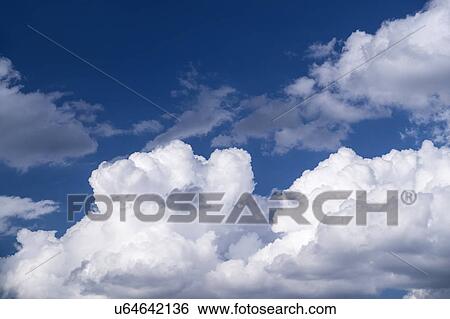 Stock Photograph - View of puffy cloud formations. Fotosearch
