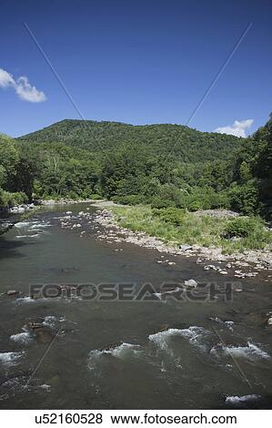 View of river on sunny day View Large Photo Image Stock Photo - View of river on sunny day. Fotosearch