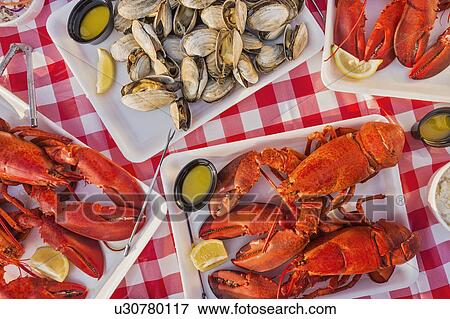 Stock Photo - View of table with lobster meal. Fotosearch