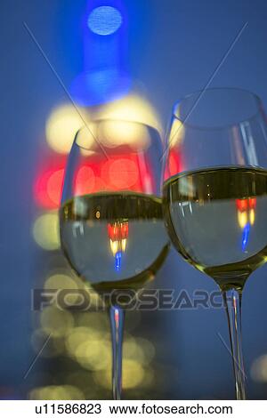 View of two wineglasses with white wine View Large Photo Image Stock Image - View of two wineglasses with white wine. Fotosearch