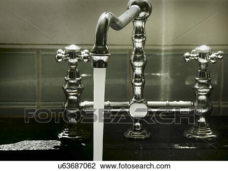 Stock Image - Water running from tap. Fotosearch