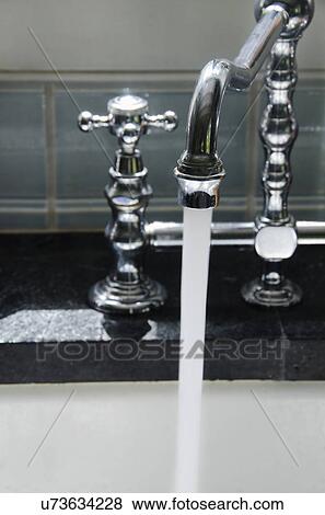 Water running from tap View Large Photo Image Stock Photo - Water running from tap. Fotosearch