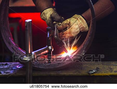 Picture - Welder working in metal workshop. Fotosearch