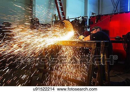 Picture - Welder working in metal workshop. Fotosearch