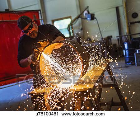 Welder working in metal workshop View Large Photo Image Stock Image - Welder working in metal workshop. Fotosearch