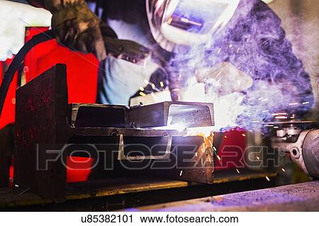 Stock Image - Welder working. Fotosearch