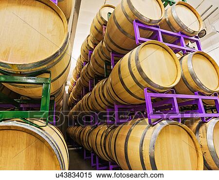 Stock Photography - Wine barrels on racks in cellar. Fotosearch