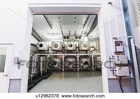 Stock Photo - Winery equipment in warehouse. Fotosearch