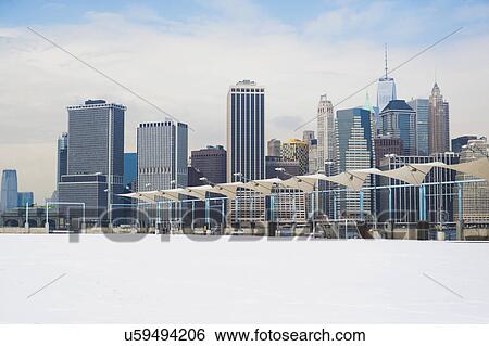 Stock Photograph - Winter cityscape under cloudy sky. Fotosearch