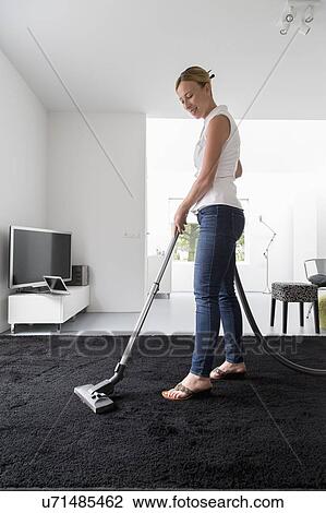 Woman cleaning house View Large Photo Image Stock Image - Woman cleaning house. Fotosearch