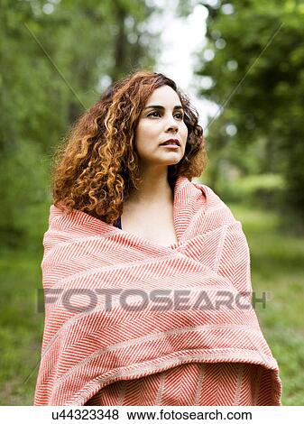 Stock Photo - Woman covered with blanket. Fotosearch