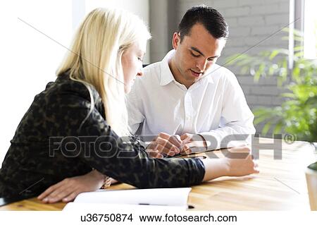 Woman discussing idea with man View Large Photo Image Picture - Woman discussing idea with man. Fotosearch