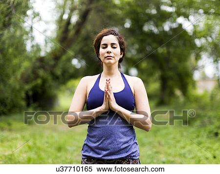 Woman exercising outdoors View Large Photo Image Stock Photography - Woman exercising outdoors. Fotosearch