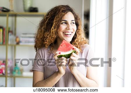 Stock Photo - Woman holding water melon. Fotosearch