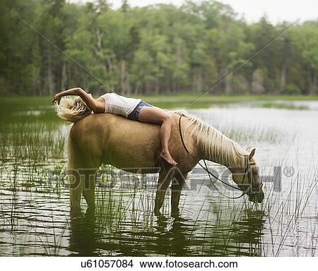 Woman horseback riding in countryside View Large Photo Image Picture - Woman horseback riding in countryside. Fotosearch