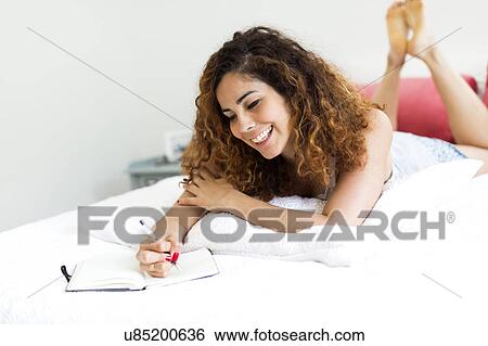 Woman in bed View Large Photo Image Stock Photograph - Woman in bed. Fotosearch