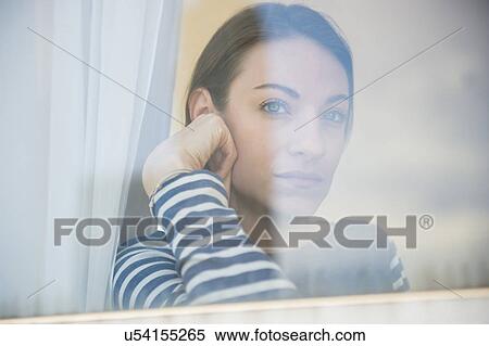 woman looking through window View Large Photo Image Stock Photography - woman looking through window. Fotosearch