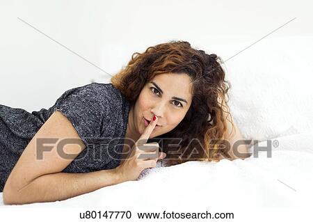 Woman lying in bed View Large Photo Image Stock Image - Woman lying in bed. Fotosearch