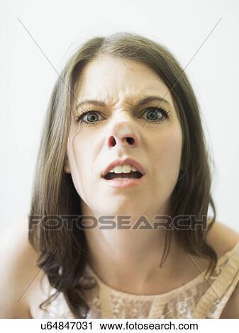 Woman making funny face on glass View Large Photo Image Stock Image - Woman making funny face on glass. Fotosearch