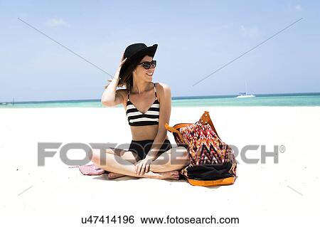 Stock Photograph - Woman on beach. Fotosearch