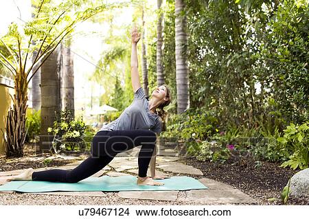 Picture - Woman practicing yoga. Fotosearch