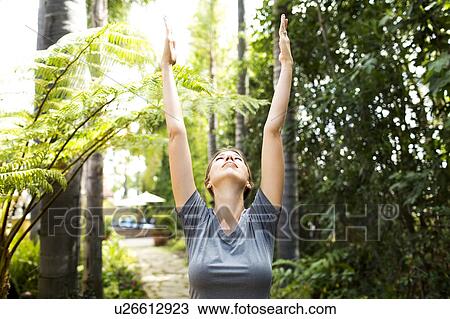 Woman practicing yoga View Large Photo Image Stock Image - Woman practicing yoga. Fotosearch