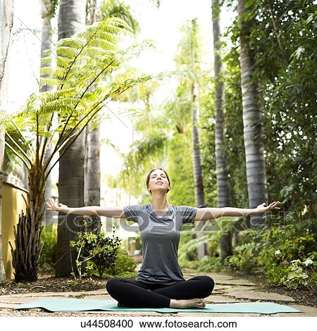 Woman practicing yoga View Large Photo Image Stock Image - Woman practicing yoga. Fotosearch
