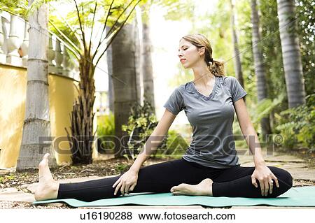 Stock Photo - Woman practicing yoga. Fotosearch