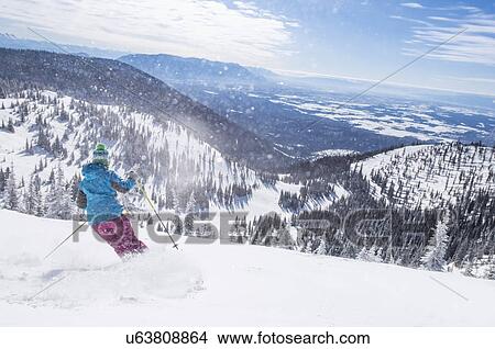 Woman skiing downhill View Large Photo Image Picture - Woman skiing downhill. Fotosearch