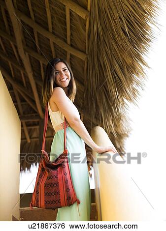 Woman standing on steps View Large Photo Image Stock Photograph - Woman standing on steps. Fotosearch