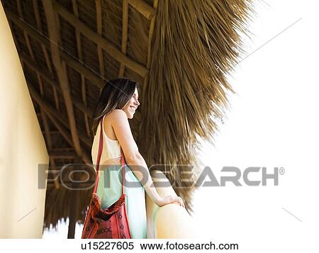 Woman standing on steps View Large Photo Image Stock Photography - Woman standing on steps. Fotosearch