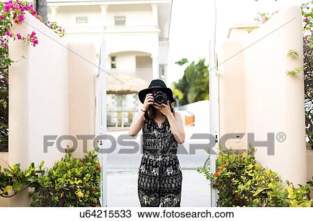 Woman taking photos during vacations View Large Photo Image Stock Image - Woman taking photos during vacations. Fotosearch