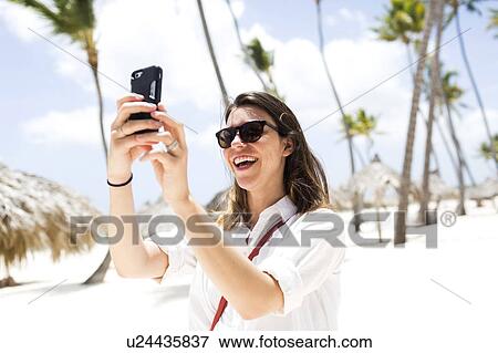 Woman taking picture View Large Photo Image Stock Photo - Woman taking picture. Fotosearch