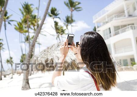 Woman taking picture View Large Photo Image Stock Photo - Woman taking picture. Fotosearch