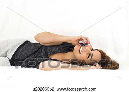 Woman talking on phone View Large Photo Image Stock Image - Woman talking on phone. Fotosearch