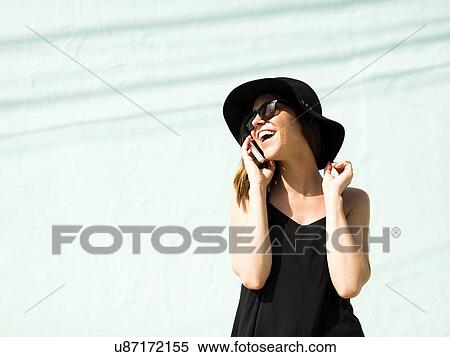 Stock Photography - Woman talking on phone. Fotosearch