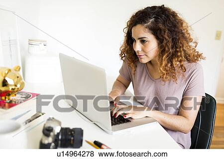 Stock Photo - Woman using laptop. Fotosearch