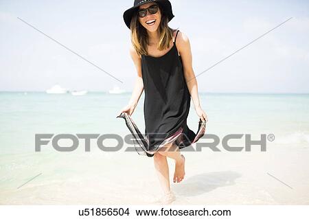woman walking on beach View Large Photo Image Picture - woman walking on beach. Fotosearch