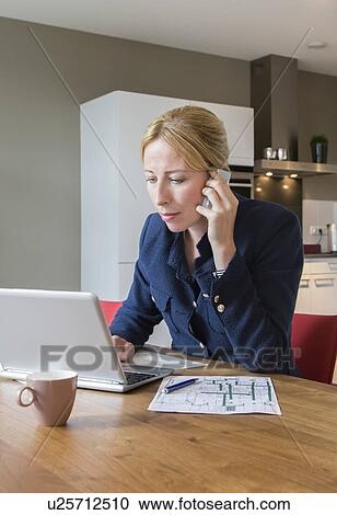 Woman working at desk View Large Photo Image Stock Image - Woman working at desk . Fotosearch