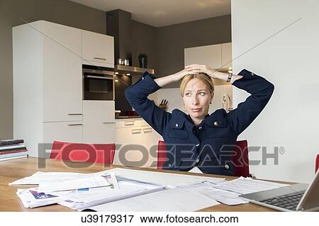 Woman working at desk View Large Photo Image Stock Photo - Woman working at desk . Fotosearch