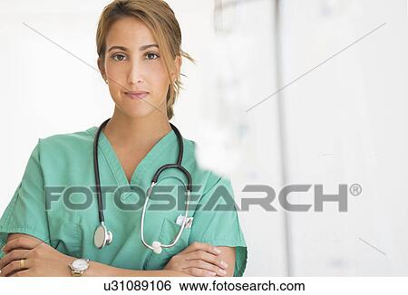 Stock Photograph - Young female doctor in hospital . Fotosearch