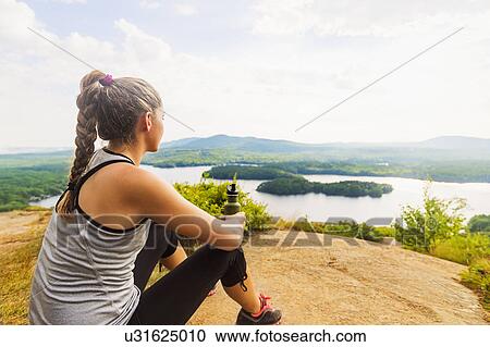 Young female hiker looking at view View Large Photo Image Stock Image - Young female hiker looking at view. Fotosearch