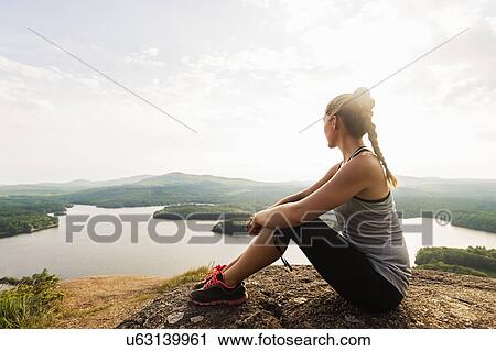 Young female hiker looking at view View Large Photo Image Stock Image - Young female hiker looking at view. Fotosearch