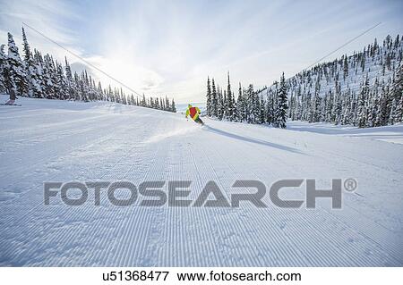 Young man speeding on ski slope View Large Photo Image Stock Photo - Young man speeding on ski slope. Fotosearch