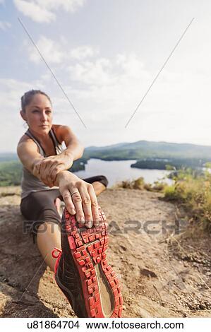 Young woman exercising outdoor View Large Photo Image Picture - Young woman exercising outdoor. Fotosearch